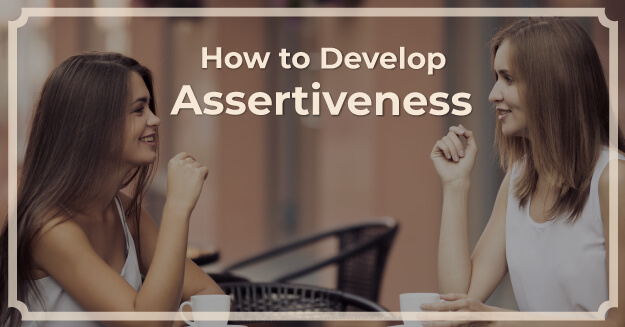 Two women sitting at a table chatting over coffee with the words How to Develop Assertiveness.