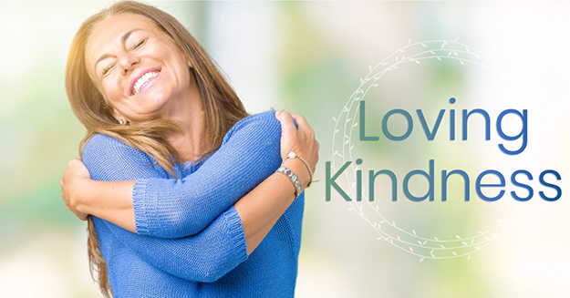 A woman hugging herself with the words loving kindness.